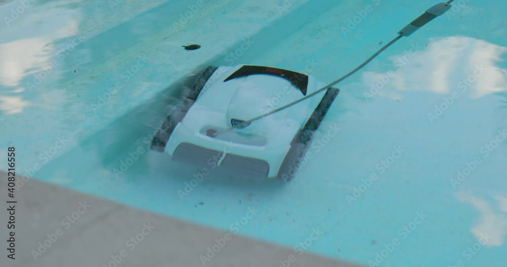 Electric Pool Cleaning Robot Cleans Steps of Swimming Pool with Clear Reflective Water Surface