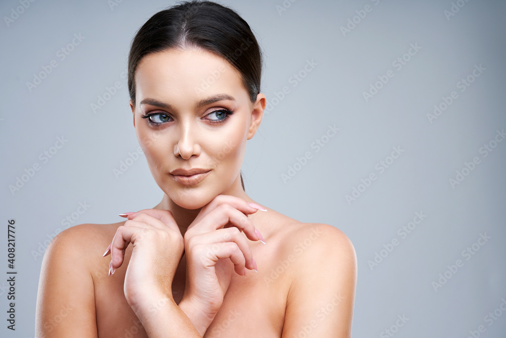Portrait of beautiful woman on gray background Portrait of beautiful woman on gray background
