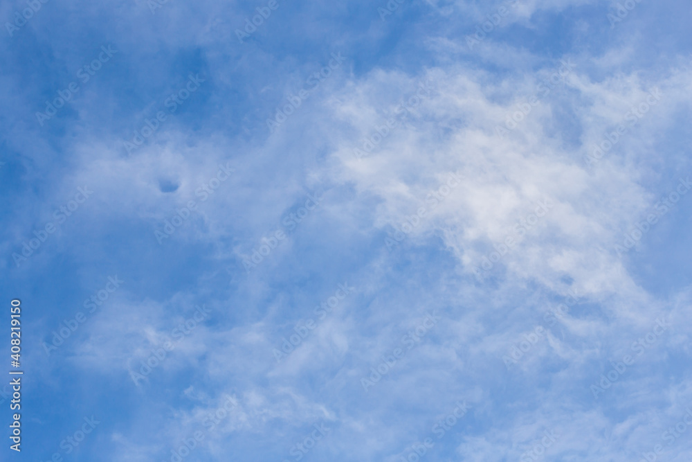 White clouds against the blue sky. Background image. White clouds against the blue sky. Background image.