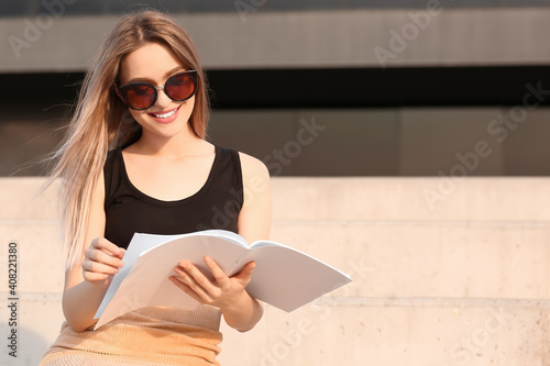 Beautiful woman reading bla...