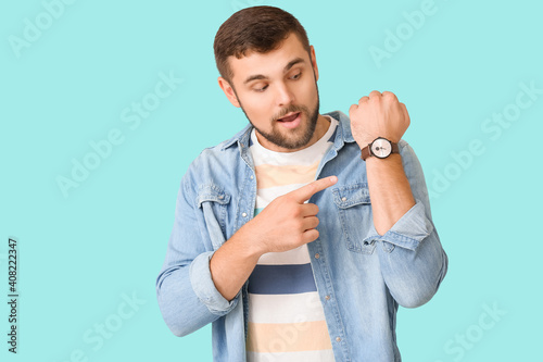 Handsome man pointing at wr...