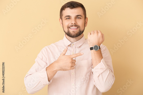 Handsome man pointing at wr...