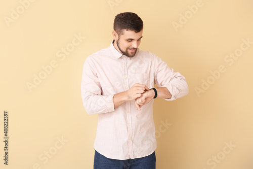 Handsome man looking at wri...