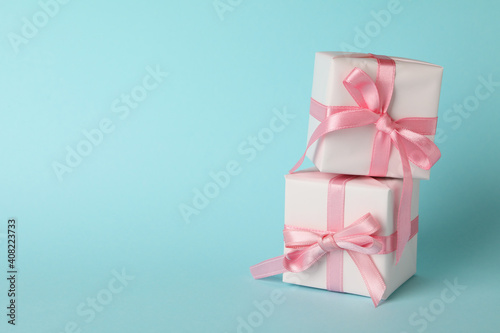 Gift boxes on blue background  space for text