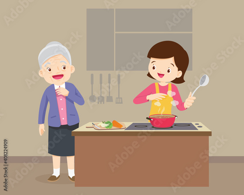 elderly woman looking to woman cooking in kitchen