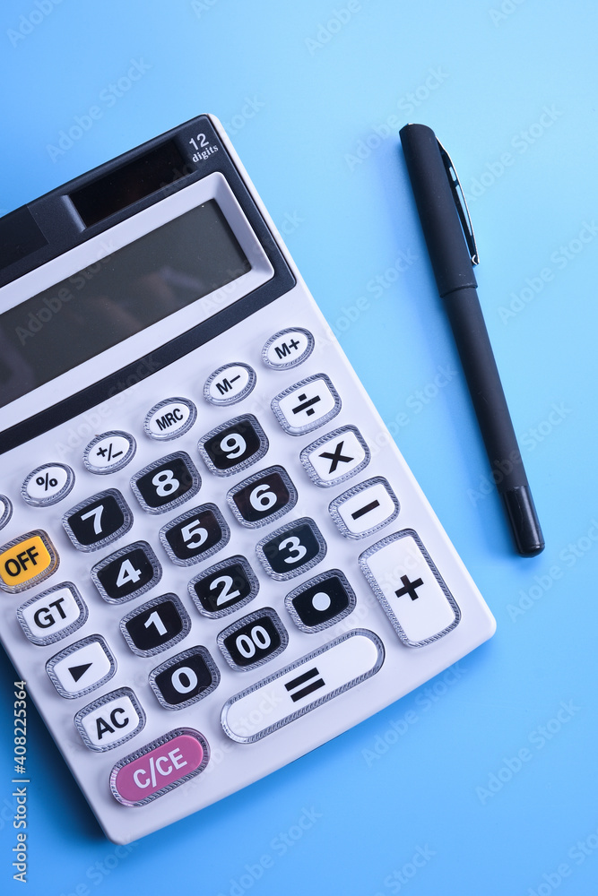 Calculator keypad on a blue background. Top view. Copy space Calculator keypad on a blue background. Top view. Copy space
