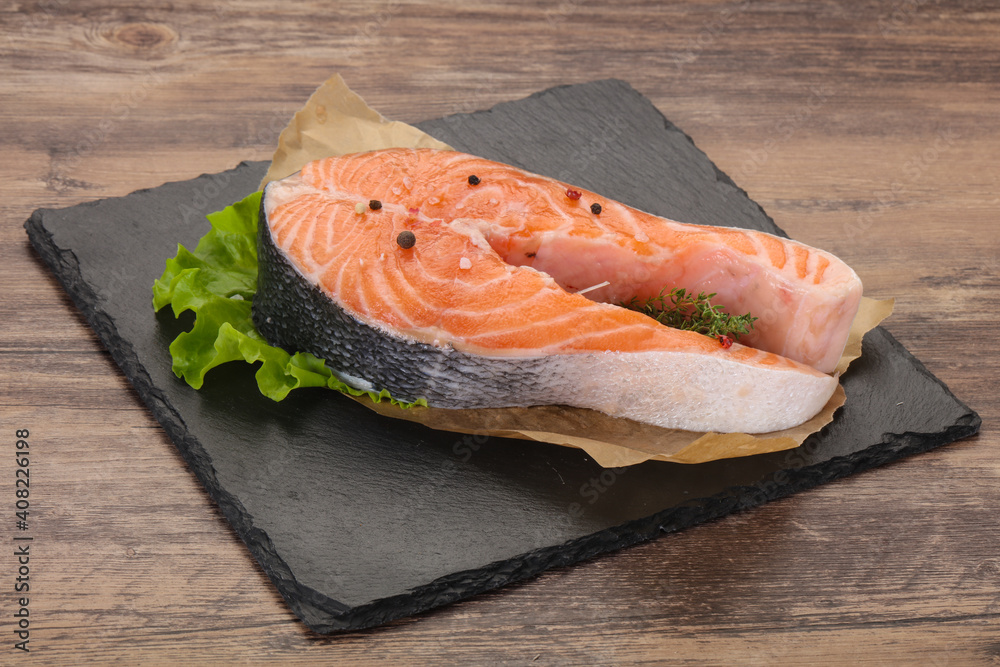 Raw salmon steak - ready for grill Raw salmon steak - ready for grill