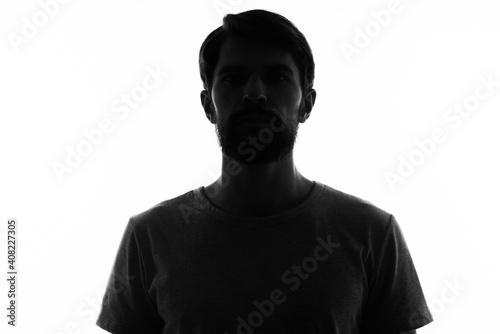 portrait of a man dark silhouette on a light background cropped view Copy Space © SHOTPRIME STUDIO