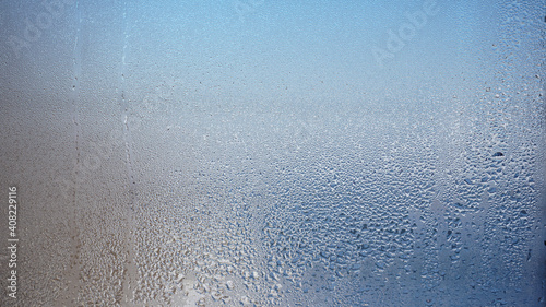 blurred glass window .Glass with water vapor,fog,stream. a window with water drops. fogged windows photo