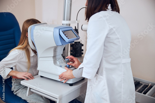 Image of examining of eyesight in office of pediatric ophthalmologist