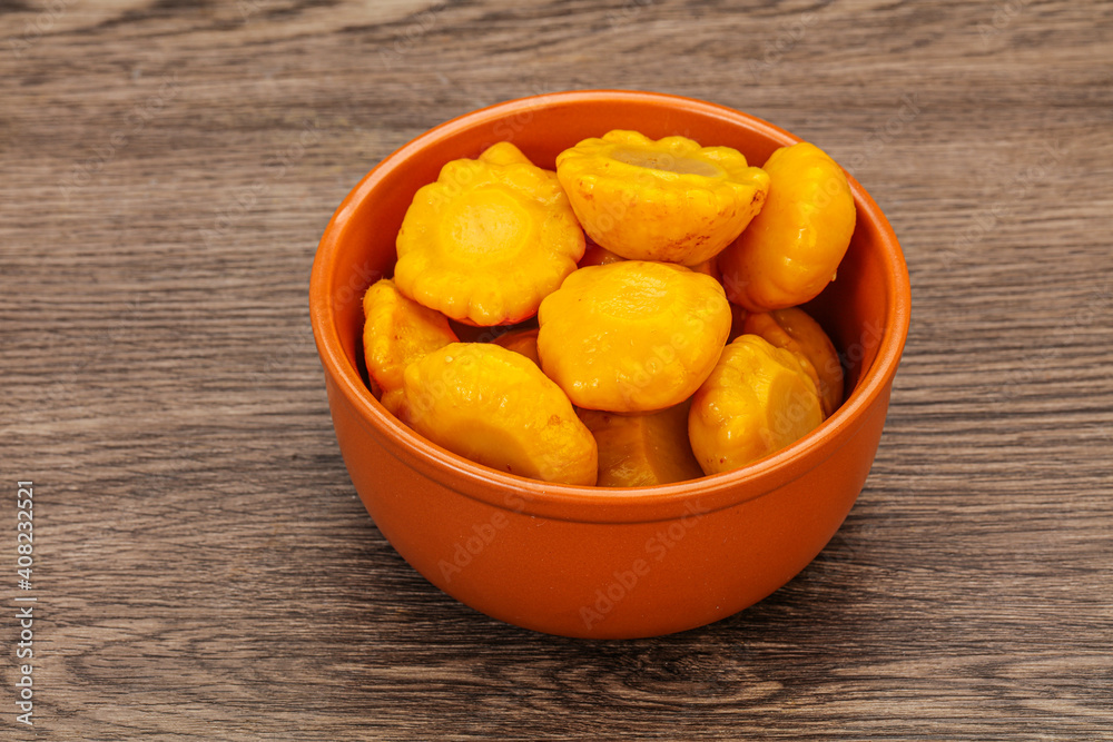 Marinated yellow patisson in the bowl Marinated yellow patisson in the bowl
