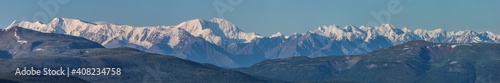 Large panorama. View of the snow-capped mountain range.