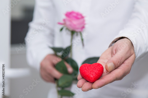 man giving the heart as a gift for Valentine's Day, happy February 14 and Valentine's Day