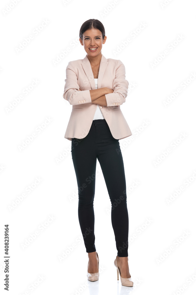 full body picture of young woman crossing arms and smiling full body picture of young woman crossing arms and smiling