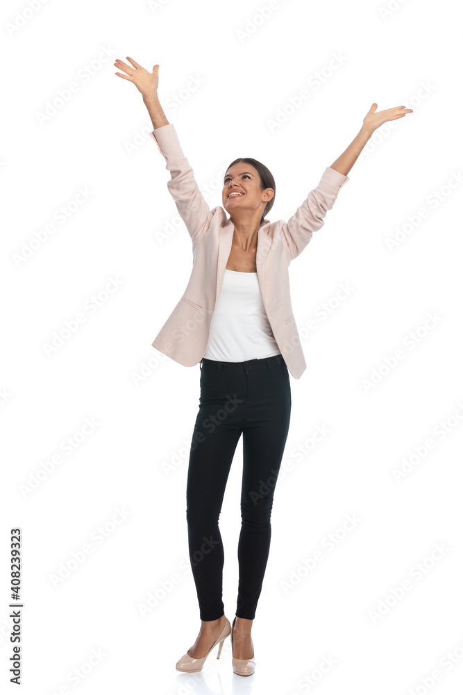 joyful young woman holding hands in the air and celebrating joyful young woman holding hands in the air and celebrating