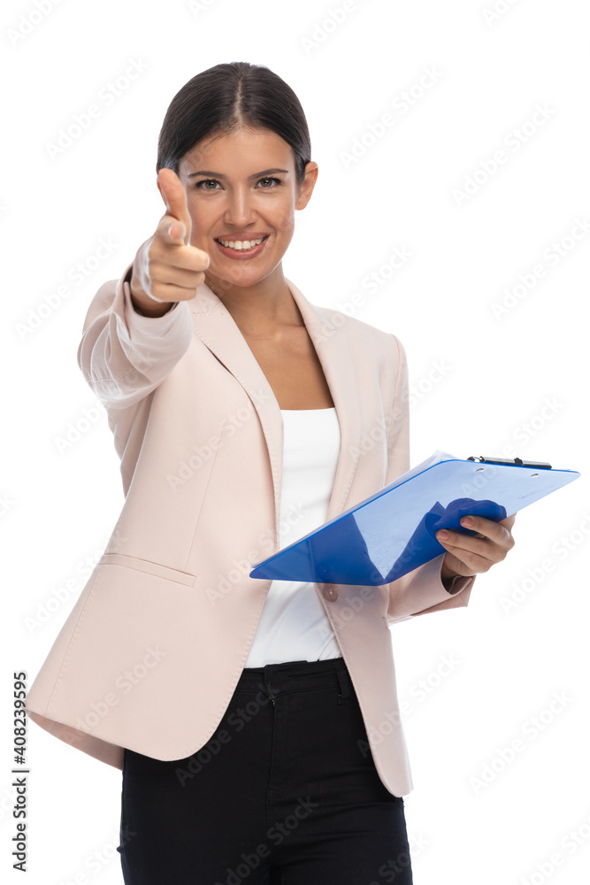 smart casual female pointing fingers and smiling smart casual female pointing fingers and smiling