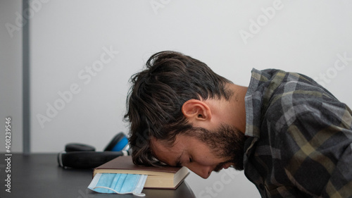 man sleeping on the desk