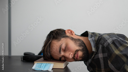 tired student sleeping on desk