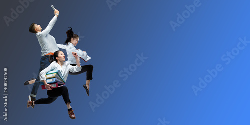 Night. Happy office workers jumping and dancing in casual clothes or suit isolated on gradient neon fluid background. Business, start-up, working open-space, motion, action concept. Creative collage.