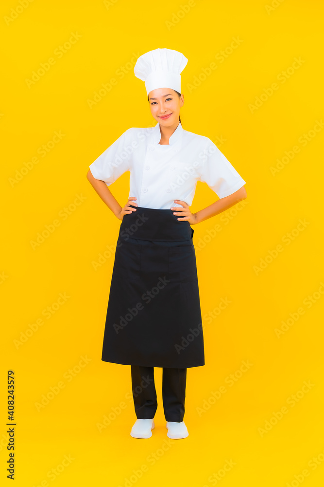 Portrait beautiful young asian woman in chef or cook uniform with hat Portrait beautiful young asian woman in chef or cook uniform with hat