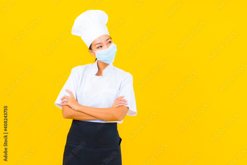 Portrait beautiful young asian woman chef wear mask for protect covid19 or coronavirus Portrait beautiful young asian woman chef wear mask for protect covid19 or coronavirus