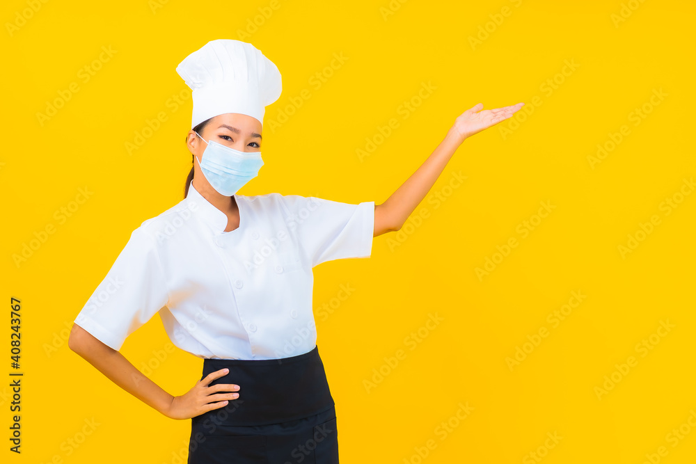 Portrait beautiful young asian woman chef wear mask for protect covid19 or coronavirus Portrait beautiful young asian woman chef wear mask for protect covid19 or coronavirus