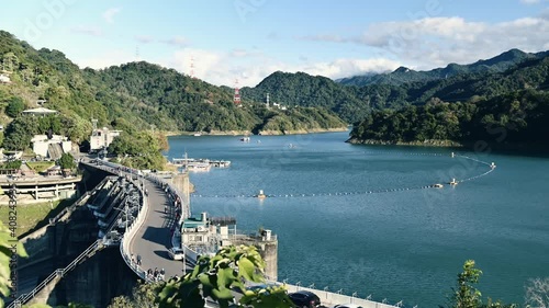 Shihmen Reservoir, Taoyuan, Taiwan - January 02, 2021: Timelapse footage of Shimen Reservoir in a sunny autumn afternoon. photo