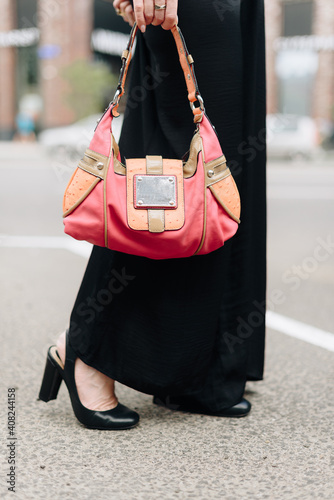 A woman with a bag on the background of the city