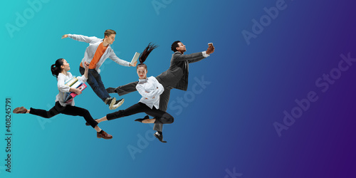 Night. Happy office workers jumping and dancing in casual clothes or suit isolated on gradient neon fluid background. Business, start-up, working open-space, motion, action concept. Creative collage.