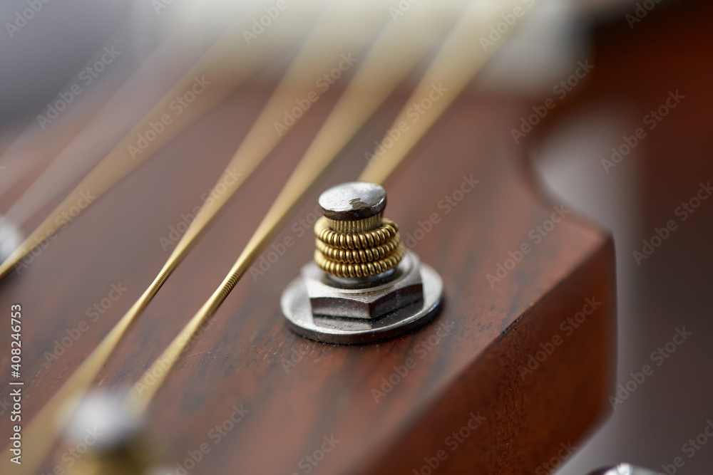 music and musical instruments concept - close up of acoustic guitar head with pegs music and musical instruments concept - close up of acoustic guitar head with pegs