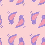 Decorative seamless pattern with pink and purple colored birds silhouettes. Pastel background.