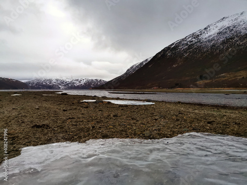 Beautiful chilling view of a river on the island of Kvaloy in Tromso, Norway photo