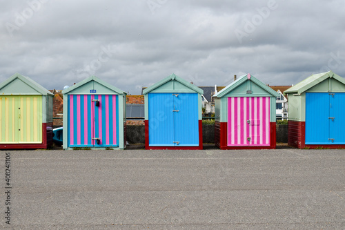A line of beach huts at Brighton beach, UK