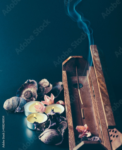 incense stick aroma with smoke  in a wooden  holder