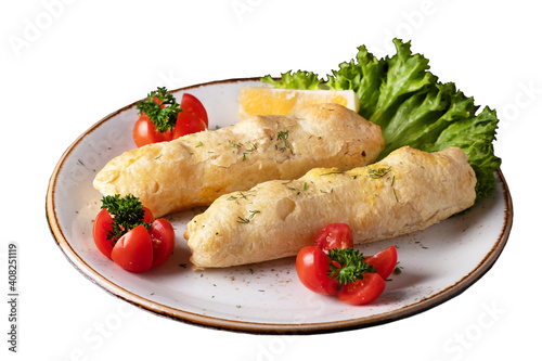 Halibut fillet in layered dough with cheese isolated on white.