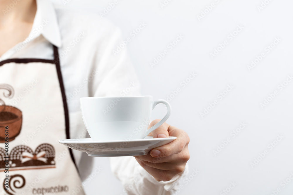 coffee time. A waiter holding and serving a glass of hot coffee, isolated in white background.
coffee time. A waiter holding and serving a glass of hot coffee, isolated in white background.