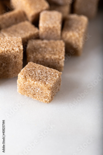 Brown sugar cubes.  Food background.