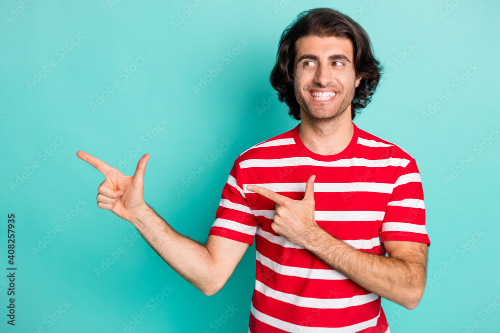 Portrait of nice cheery content guy demonstrating copy space advice novelty isolated over bright green turquoise color background Portrait of nice cheery content guy demonstrating copy space advice novelty isolated over bright green turquoise color background