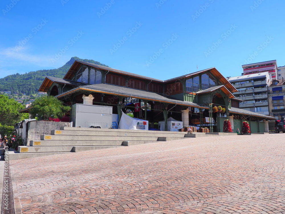MONTREUX, SWITZERLAND on JULY 2017: Building of wooden market hall in european city in canton Vaud, clear blue sky in warm sunny summer day.