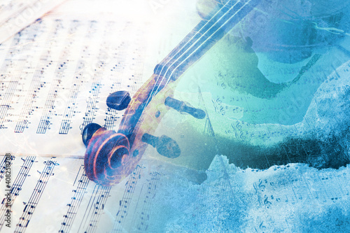 Old violin lying on the sheet of music, abstract watercolor concept