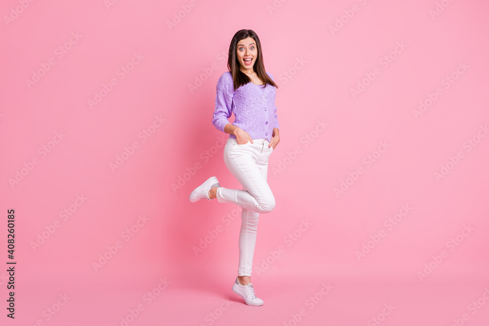 Full body profile side photo of young happy smile surprised woman hands in pocket isolated over pink color background Full body profile side photo of young happy smile surprised woman hands in pocket isolated over pink color background