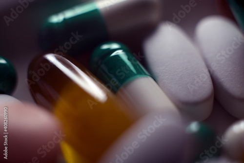 Tablets and pills piled closely together. Pills and pills close up.