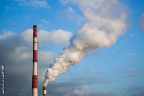 Smoke escaping from the chimney into the atmosphere