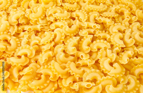 Pasta background. The pasta is filled with an even layer.