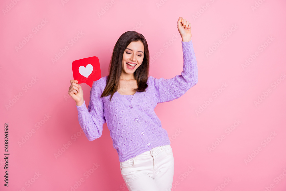 Photo of optimistic girl hold like dance wear lilac sweater trousers isolated on pink color background Photo of optimistic girl hold like dance wear lilac sweater trousers isolated on pink color background