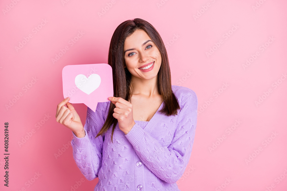 Photo of young attractive girl happy positive smile hold notification icon isolated over pink color background Photo of young attractive girl happy positive smile hold notification icon isolated over pink color background