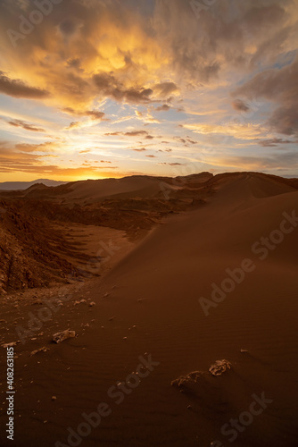 Scenic view of Atacama Desert with sandy dunes and rough rocks on sunny day in Chile