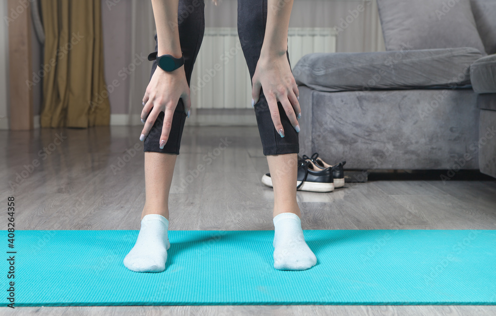 Young woman with fitness mat in home. Healthy life Young woman with fitness mat in home. Healthy life