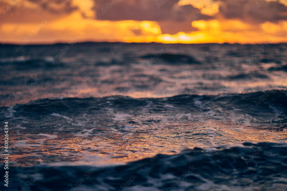waves in the ocean with sunset waves in the ocean with sunset