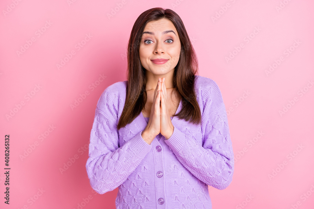 Portrait of optimistic nice girl hands together pray wear lilac sweater isolated on pink color background Portrait of optimistic nice girl hands together pray wear lilac sweater isolated on pink color background